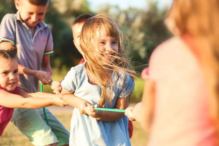 Children playing together outdoors symbolizing social engagement by Private Palace Hotels & Resorts