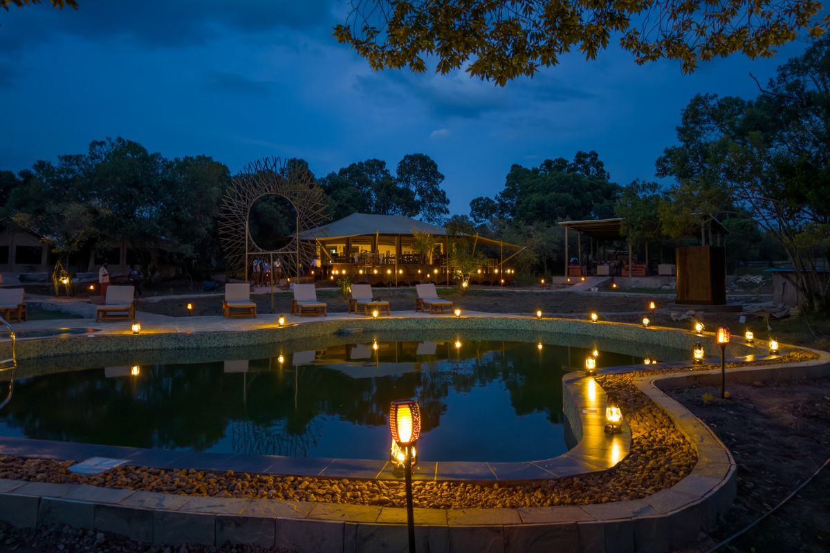 Illuminated pool area at Ilora Retreats luxury camp in the Masai Mara Kenya