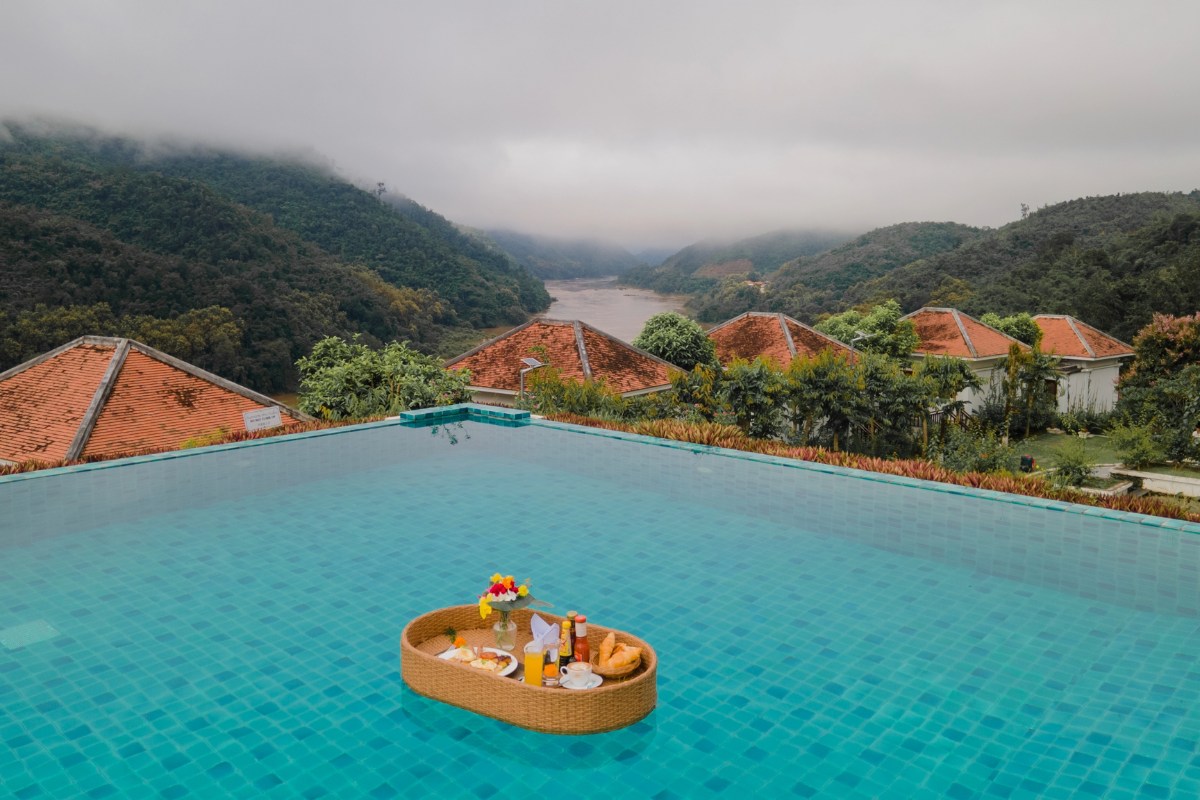 Infinity pool at Le Grand Pakbeng with view over the Mekong River and jungle mountains in Pak Beng Laos