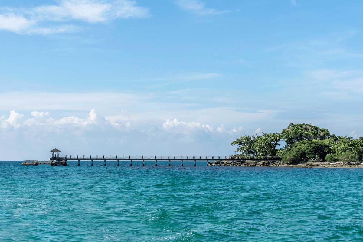 Pier at Nam Nghi Coral Peninsula Phu Quoc Resort over turquoise sea