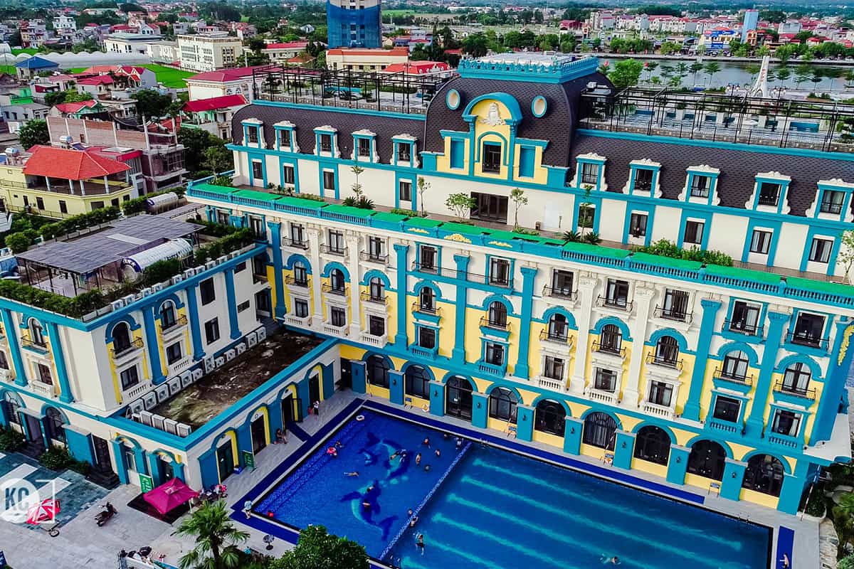 Aerial view of Thien An Hotel Viet Yen with pool and colorful facade