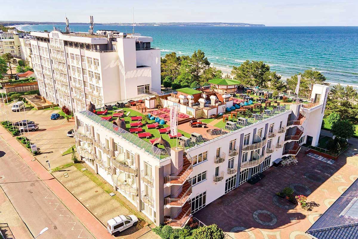 Rooftop terrace of Arkona Strandhotel Binz with seating areas overlooking the Baltic Sea